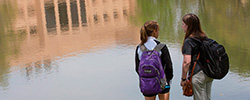 UT Tyler students on campus in front of lake